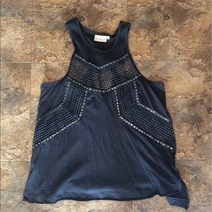 Grey tank with some cutouts and bling